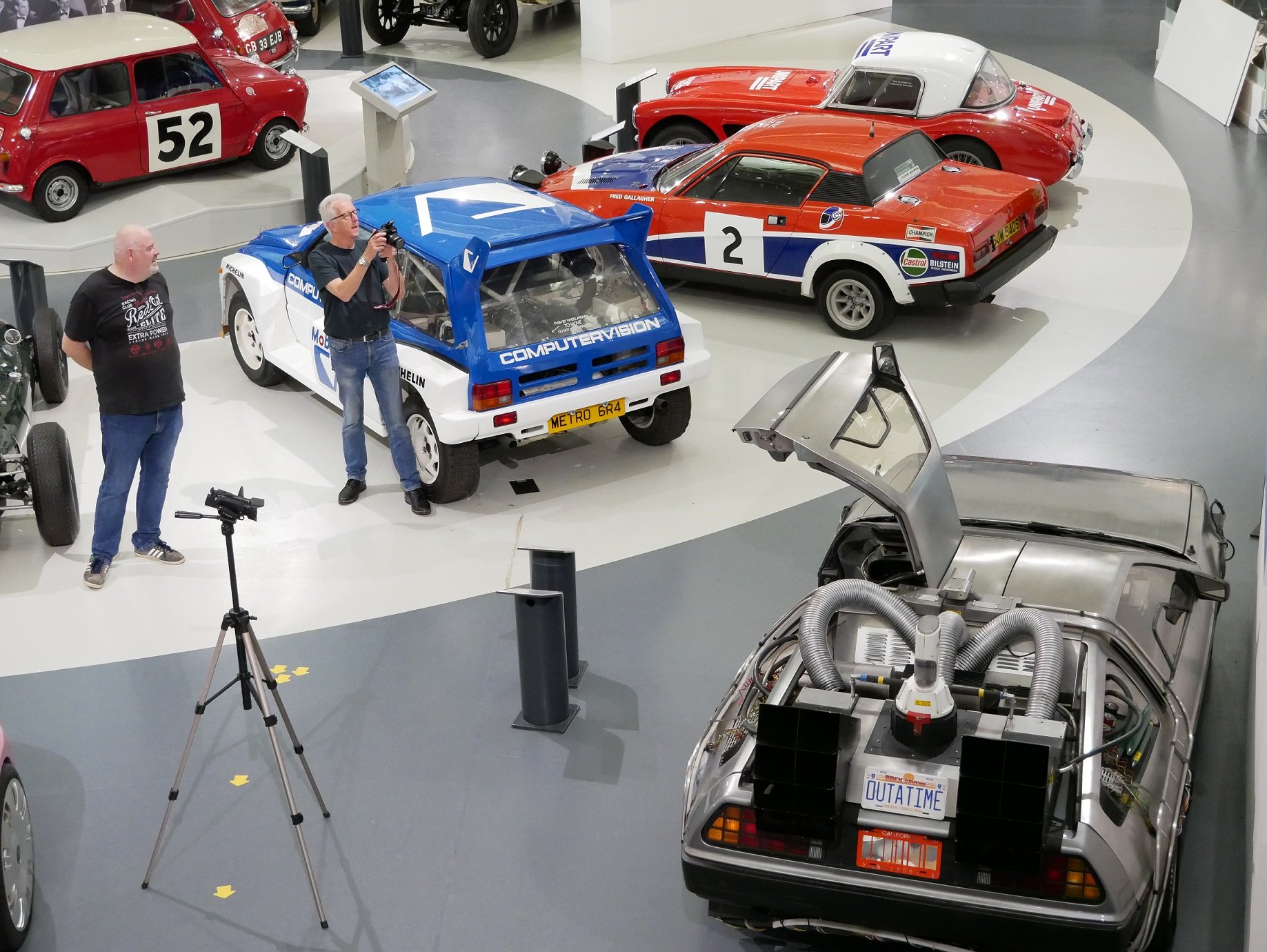 Volunteer taking photos of the Delorean