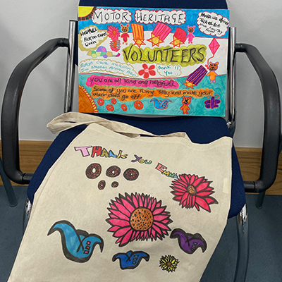 A thank you painted canvas and tote bag for the volunteers and for Emma.