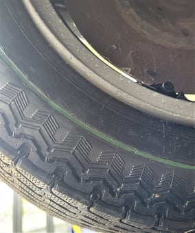 The original Zanda tyres, with a green stripe still visible.