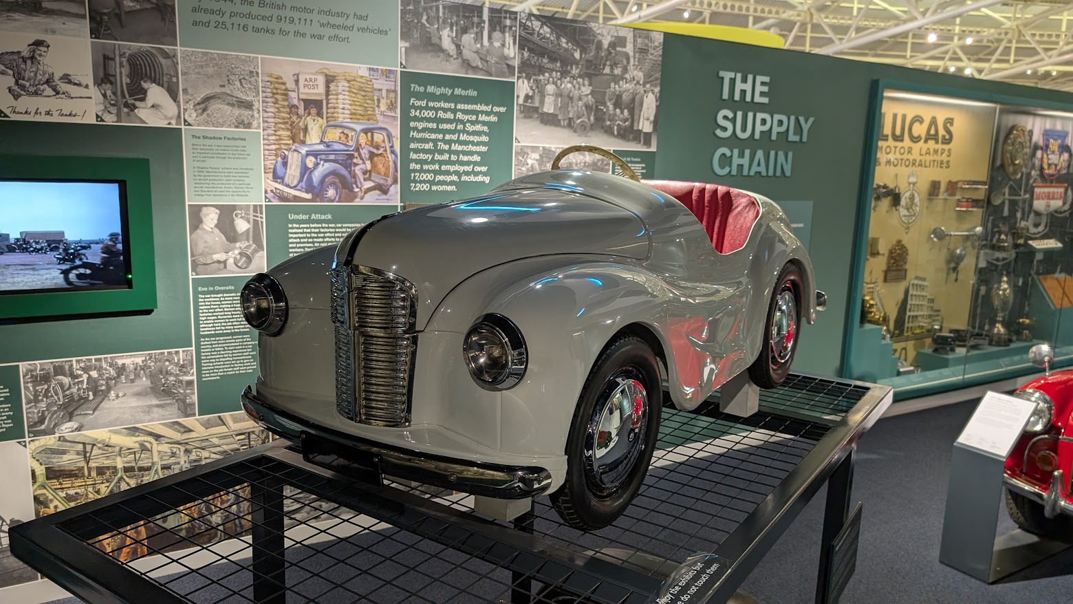 A white and red Austin J40 pedal car